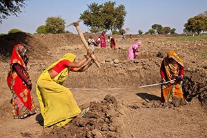 Women mark the area to be dug by workers and oversee the work’s completion in Village Satavasa, Lalitpur, Uttar Pradesh. Photo: UN Women/Gaganjit Singh Chandok